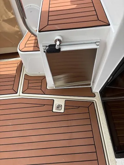Marcia Jean Yacht Photos Pics 2023 Ranger Tugs R-29 S boat deck with wood finish and storage compartment.