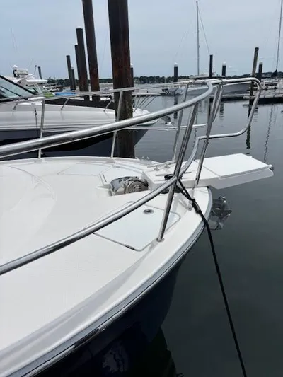 Marcia Jean Yacht Photos Pics 2023 Ranger Tugs R-29 S boat docked at marina, featuring sleek bow design.