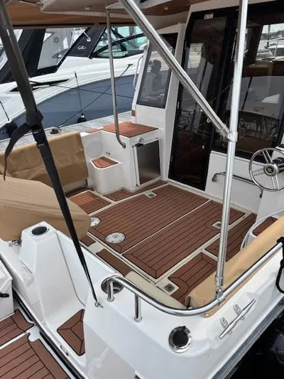 Marcia Jean Yacht Photos Pics 2023 Ranger Tugs R-29 S boat deck with teak flooring and seating area.