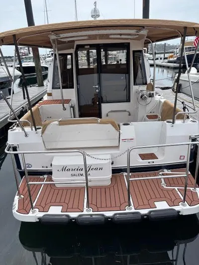 Marcia Jean Yacht Photos Pics 2023 Ranger Tugs R-29 S boat docked, rear view with teak deck and canopy.