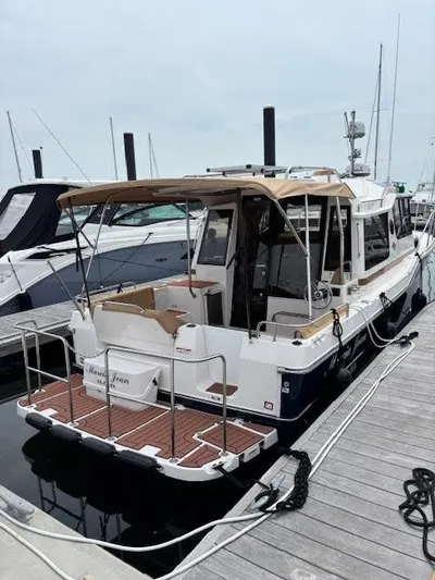 Marcia Jean Yacht Photos Pics 2023 Ranger Tugs R-29 S docked at marina, rear view.