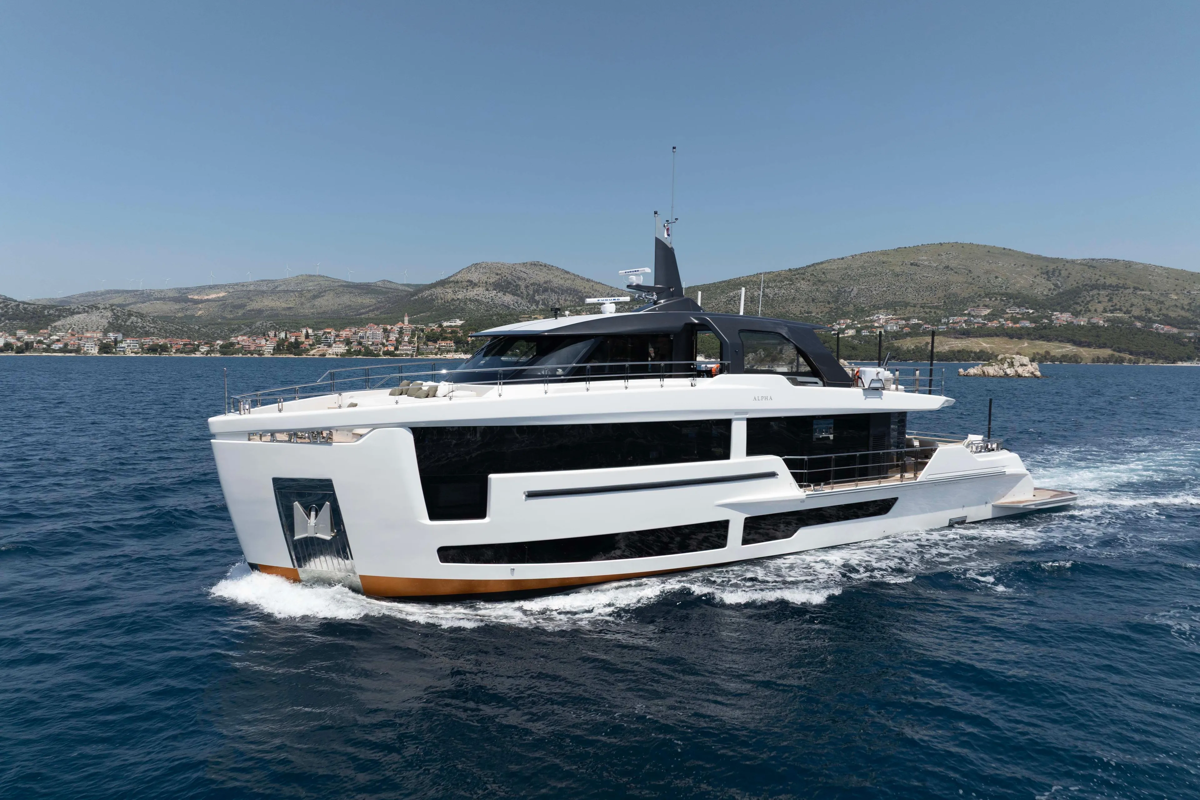 Luxury yacht "Alpha 100 Squalo Co Ownership" cruising in scenic waters, 2025 model.