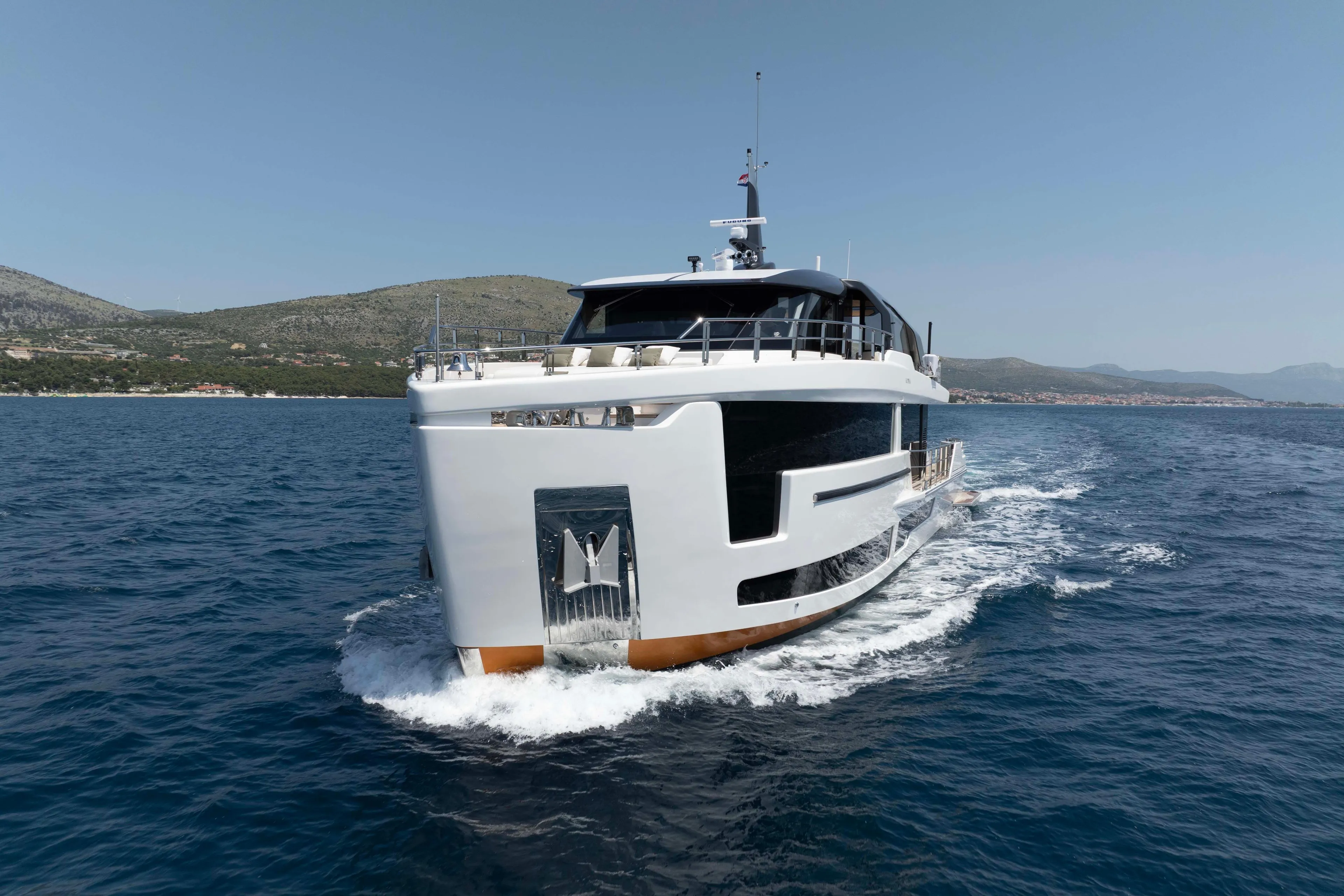 Luxurious 2025 Alpha 100 Squalo Co Ownership yacht cruising on open sea.