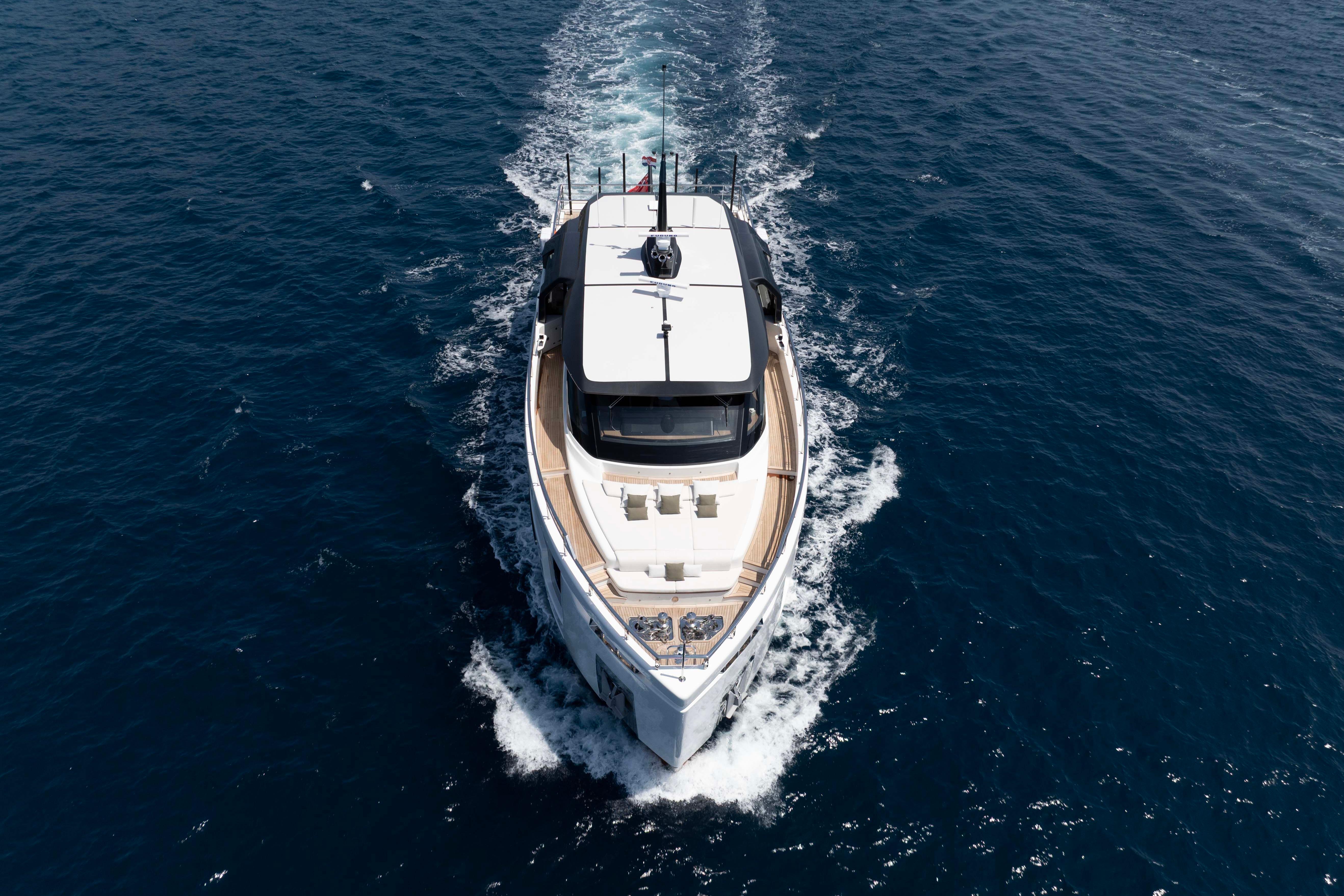 Aerial view of 2025 Alpha 100 Squalo Co Ownership yacht cruising on open sea.