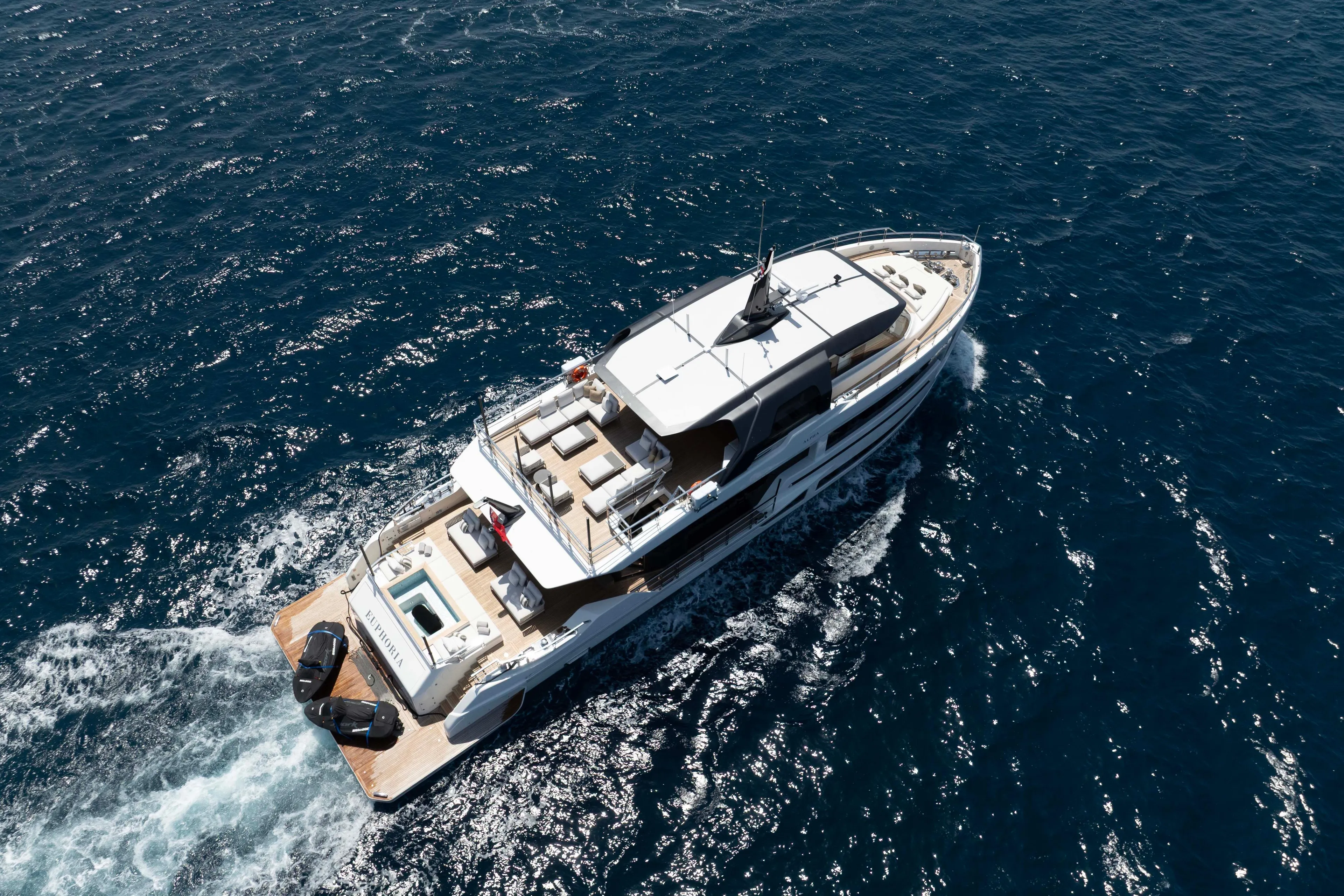 Luxury yacht "Alpha 100 Squalo Co Ownership" cruising on open sea, 2025 model.