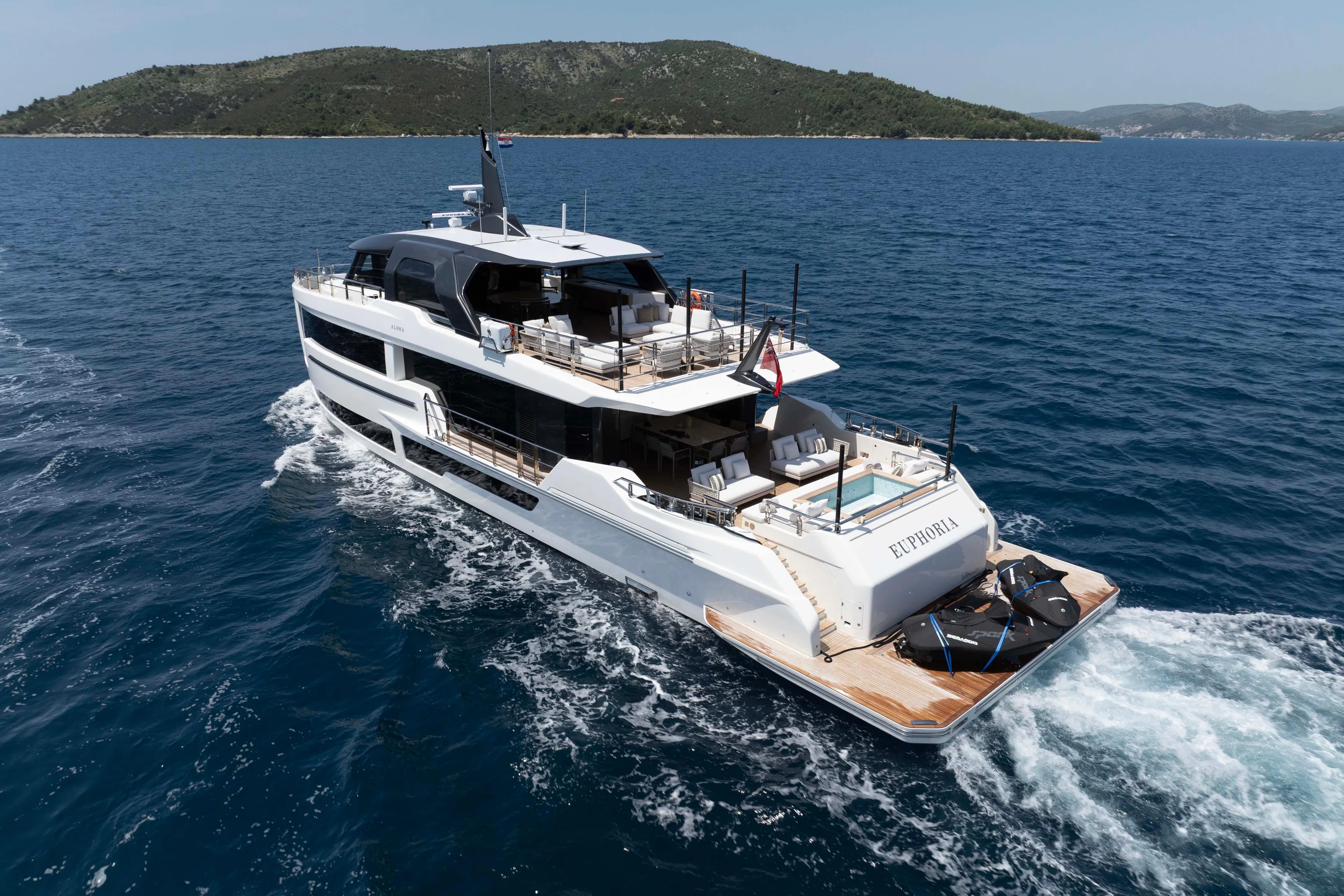 Luxurious 2025 Alpha 100 Squalo Co Ownership yacht cruising on open sea.