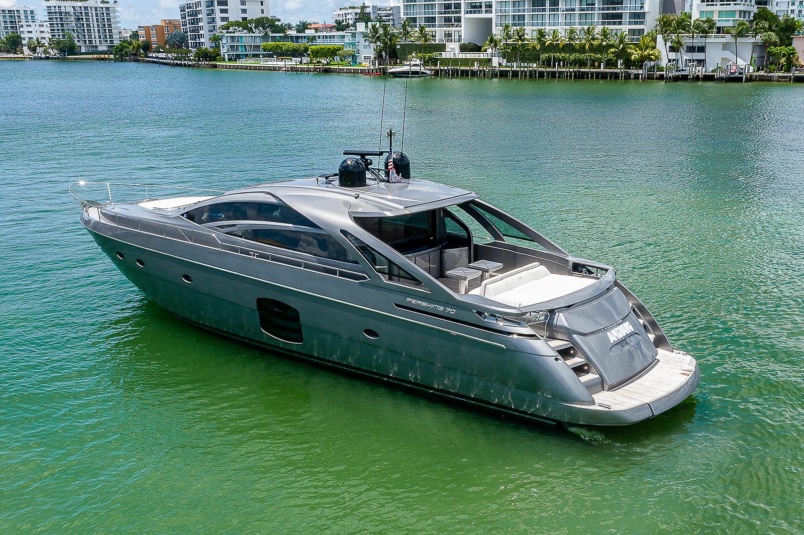 2015 Pershing 70 yacht on calm water, modern design, luxury vessel.
