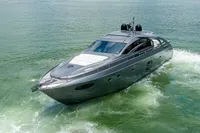 2015 Pershing 70 yacht cruising on open water, showcasing sleek design and luxury features.