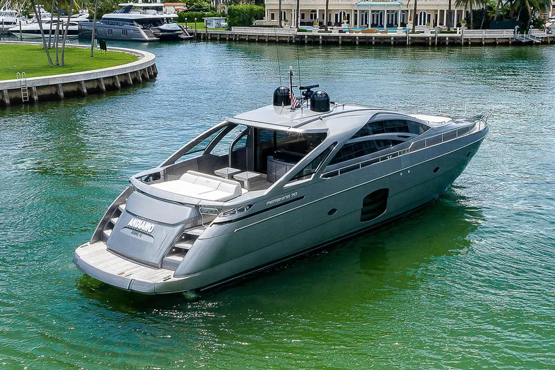 Andiamo Yacht Photos Pics Luxurious 2015 Pershing 70 yacht cruising in a serene waterfront setting.