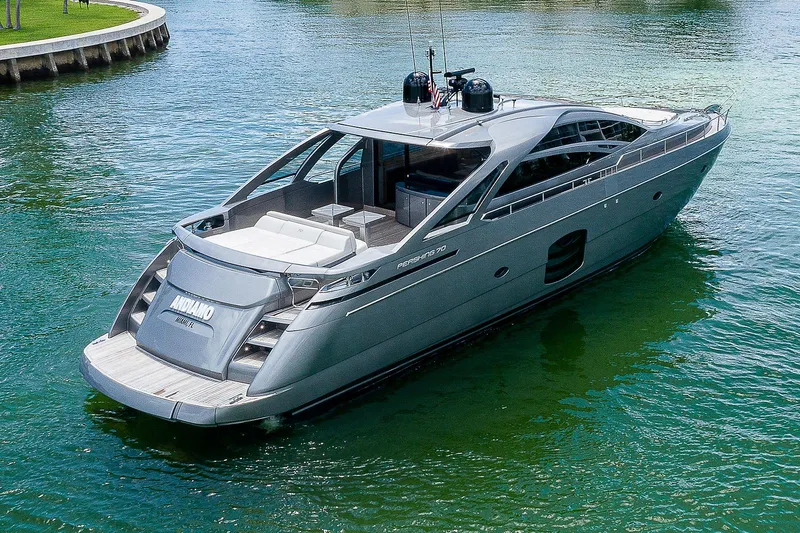 Andiamo Yacht Photos Pics Luxury 2015 Pershing 70 yacht on calm water, showcasing sleek design and modern features.