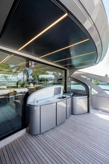 Andiamo Yacht Photos Pics Luxury 2015 Pershing 70 yacht deck with sleek design and modern amenities.