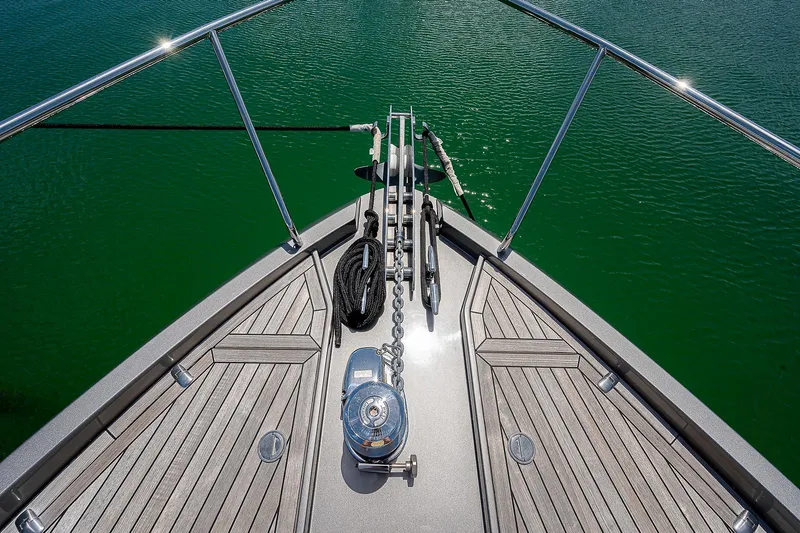 Andiamo Yacht Photos Pics Bow view of 2015 Pershing 70 yacht with teak decking and anchor system.