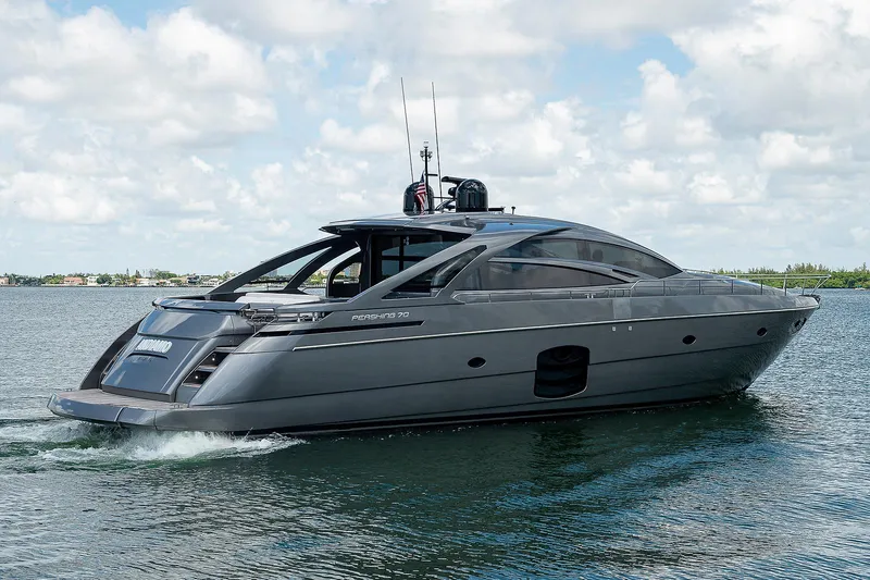 Andiamo Yacht Photos Pics 2015 Pershing 70 yacht cruising on a sunny day with blue skies.