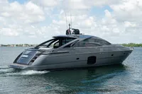 2015 Pershing 70 yacht cruising on a sunny day with blue skies.