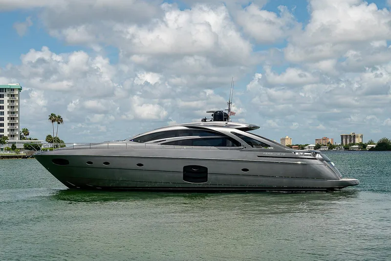 Andiamo Yacht Photos Pics 2015 Pershing 70 yacht on calm water under a partly cloudy sky.