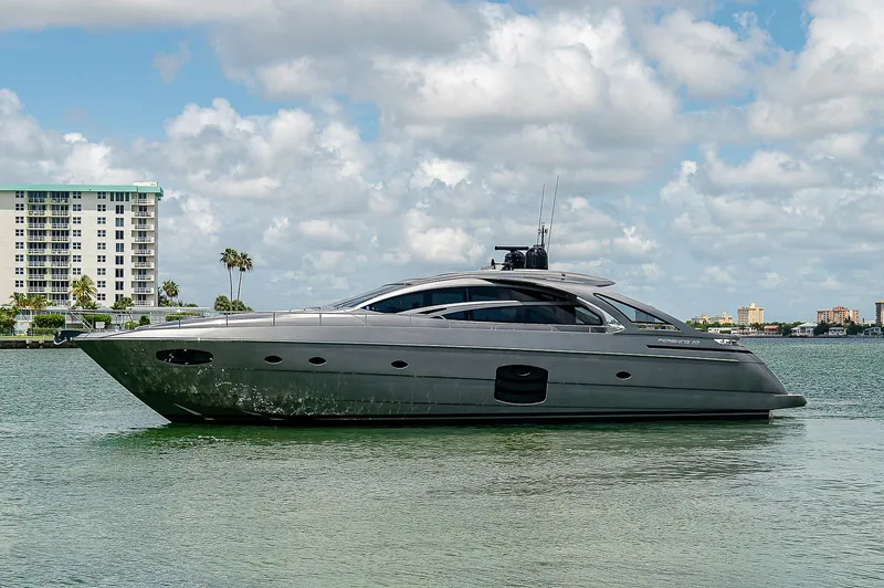 Andiamo Yacht Photos Pics 2015 Pershing 70 yacht on calm water with cityscape background.