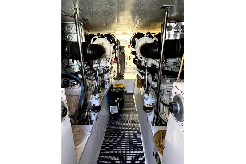  Yacht Photos Pics Engine room of 2003 Hatteras 60 Convertible yacht, showcasing dual engines and equipment.