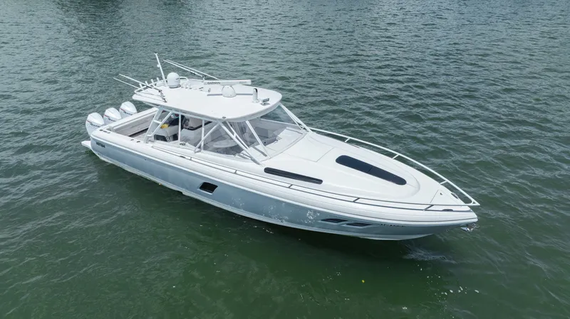 Intrepid Yacht Photos Pics 2013 Intrepid 400 Cuddy boat on calm water, aerial view.