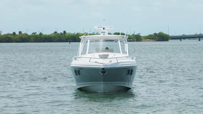 Intrepid Yacht Photos Pics 2013 Intrepid 400 Cuddy boat on calm water, front view.