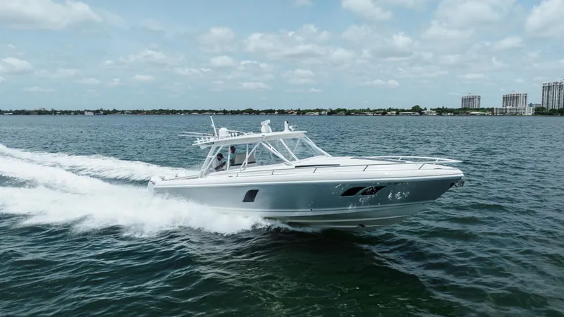 Intrepid Yacht Photos Pics 2013 Intrepid 400 Cuddy cruising on open water under a partly cloudy sky.