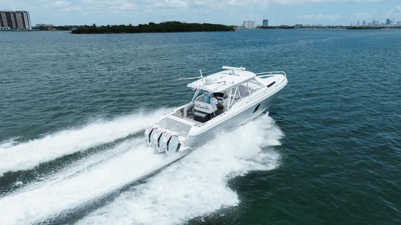 Intrepid Yacht Photos Pics 2013 Intrepid 400 Cuddy cruising on open water, showcasing powerful engines and sleek design.