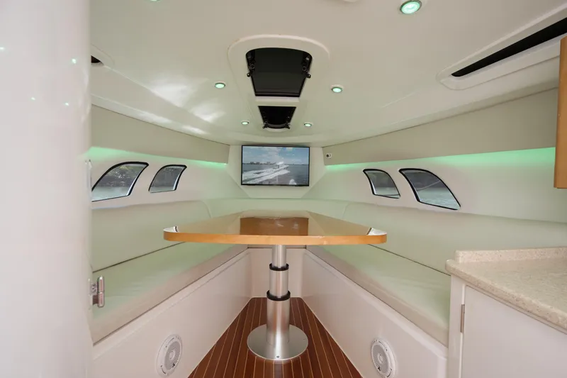 Intrepid Yacht Photos Pics Interior of 2013 Intrepid 400 Cuddy boat with modern seating and table.