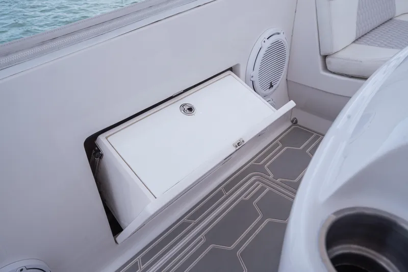 Intrepid Yacht Photos Pics 2013 Intrepid 400 Cuddy boat interior with storage compartment and speaker.