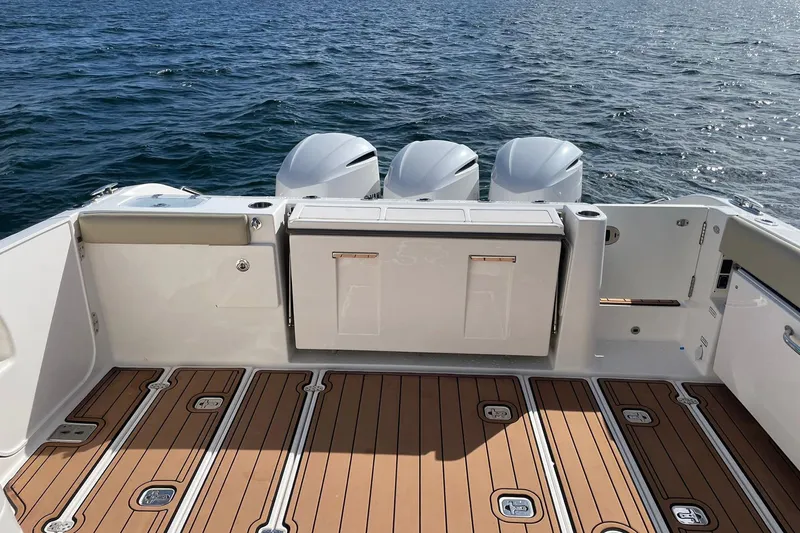 Lady B Yacht Photos Pics 2019 Pursuit DC 365 Dual Console boat with triple engines on open water.