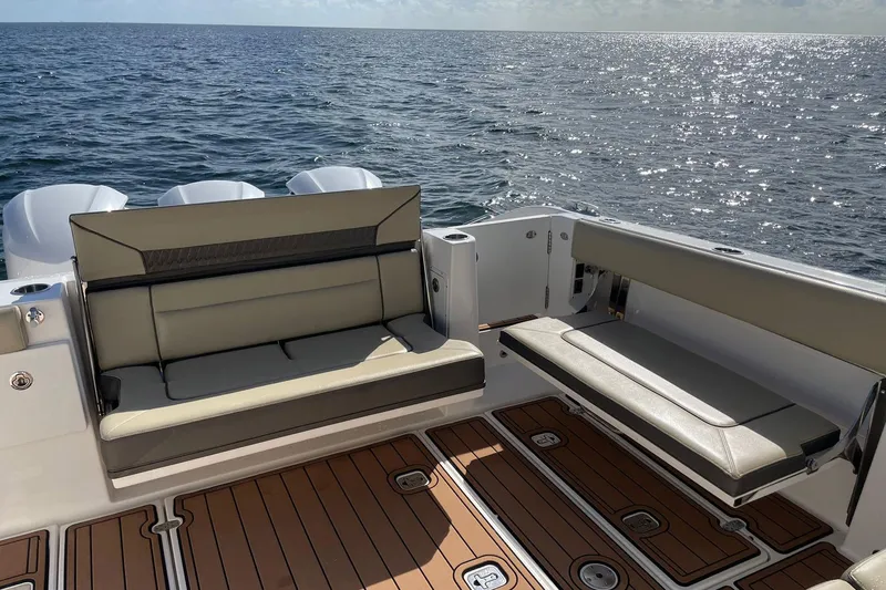 Lady B Yacht Photos Pics 2019 Pursuit DC 365 Dual Console boat interior with cushioned seating and ocean view.
