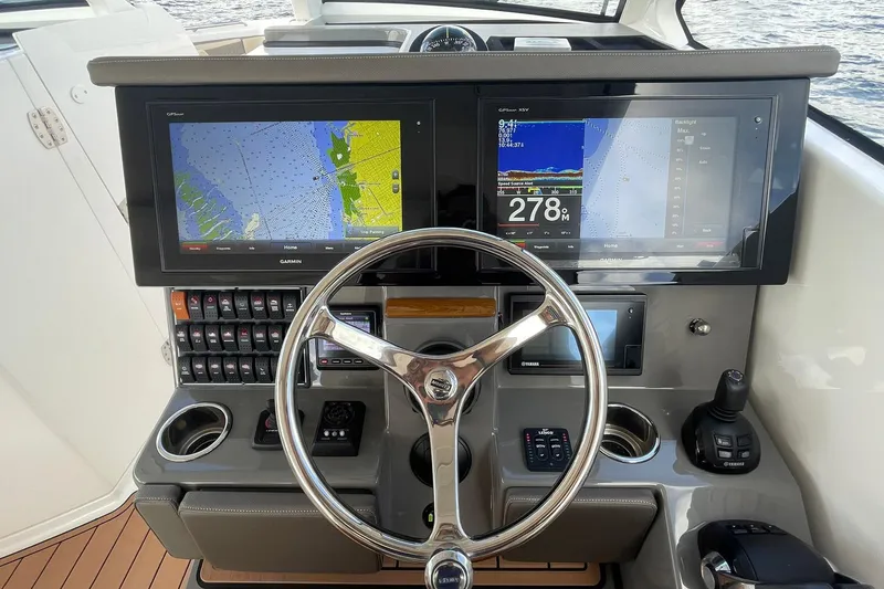 Lady B Yacht Photos Pics 2019 Pursuit DC 365 Dual Console helm with dual Garmin displays and modern controls.