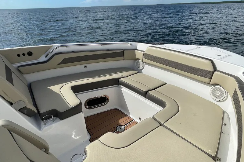 Lady B Yacht Photos Pics 2019 Pursuit DC 365 Dual Console boat interior with cushioned seating, on open water.