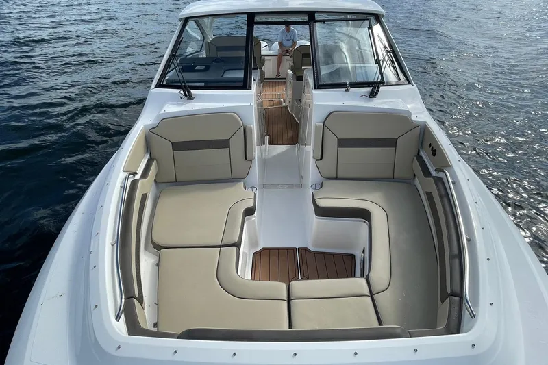 Lady B Yacht Photos Pics 2019 Pursuit DC 365 Dual Console boat with spacious seating on calm water.