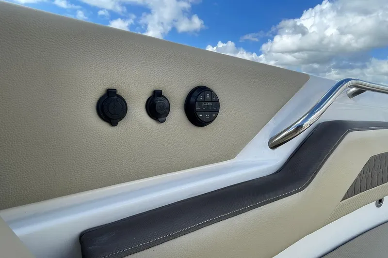 Lady B Yacht Photos Pics 2019 Pursuit DC 365 Dual Console boat interior with audio controls and sleek design.