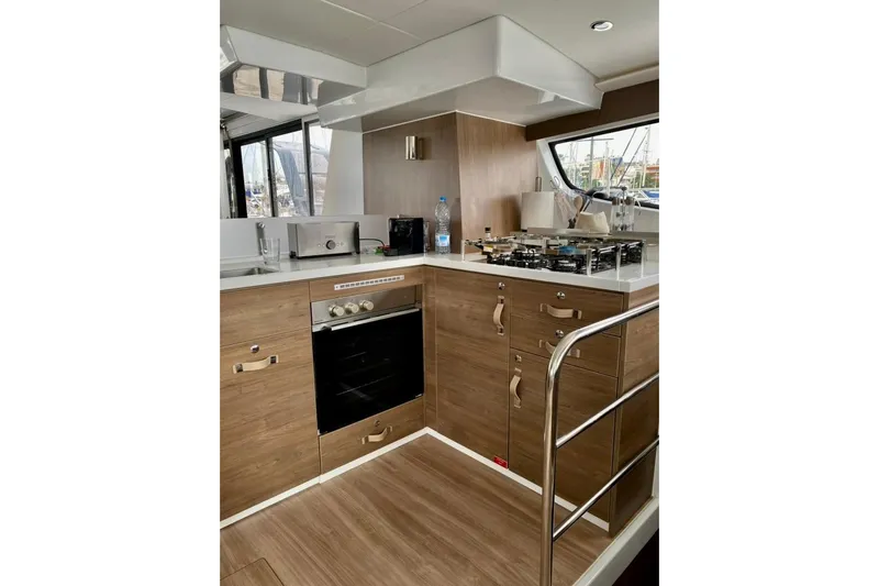 Nia Yacht Photos Pics Modern kitchen in 2022 Bali 4.6 yacht with wood cabinets and stainless steel appliances.