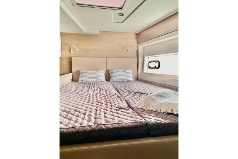 Nia Yacht Photos Pics Luxurious 2022 Bali 4.6 yacht bedroom with cozy bedding and modern design.