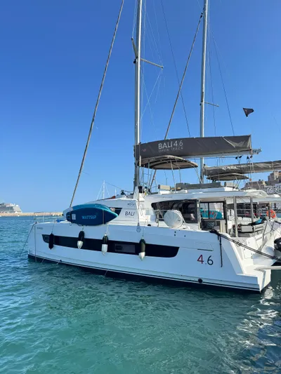 Nia Yacht Photos Pics 2022 Bali 4.6 catamaran docked in a sunny marina.
