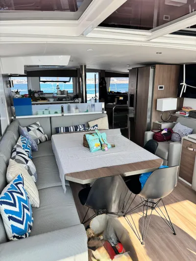 Nia Yacht Photos Pics Interior of 2022 Bali 4.6 yacht with modern dining area and ocean view.