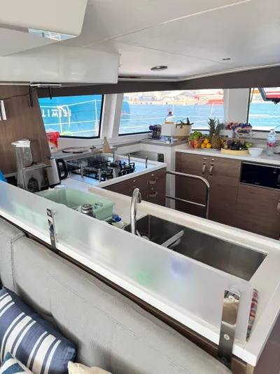 Nia Yacht Photos Pics Modern kitchen interior on Bali 4.6 yacht, featuring appliances and fruit, 2022 model.