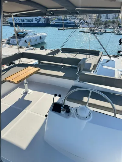 Nia Yacht Photos Pics Spacious deck of a 2022 Bali 4.6 yacht in a sunny marina.