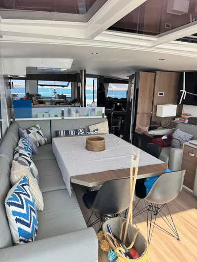 Nia Yacht Photos Pics Luxurious interior of 2022 Bali 4.6 yacht with modern seating and ocean view.