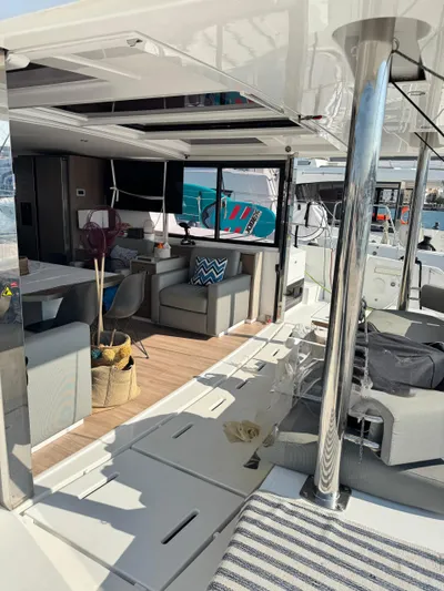 Nia Yacht Photos Pics Luxurious Bali 4.6 yacht interior, 2022 model, featuring modern seating and dining area.