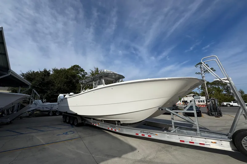  Yacht Photos Pics 2023 Invincible 46 Catamaran on trailer under clear sky.