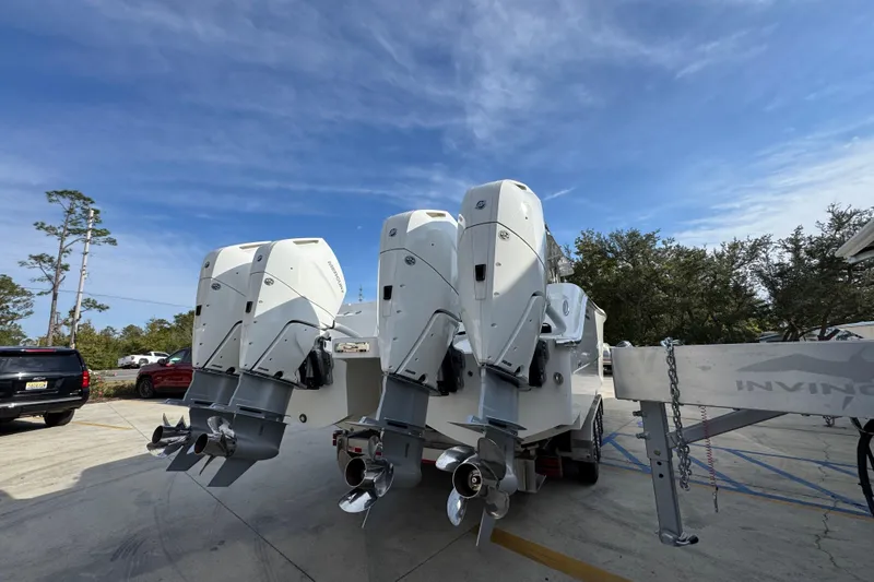  Yacht Photos Pics 2023 Invincible 46 Catamaran with triple outboard engines on a trailer.