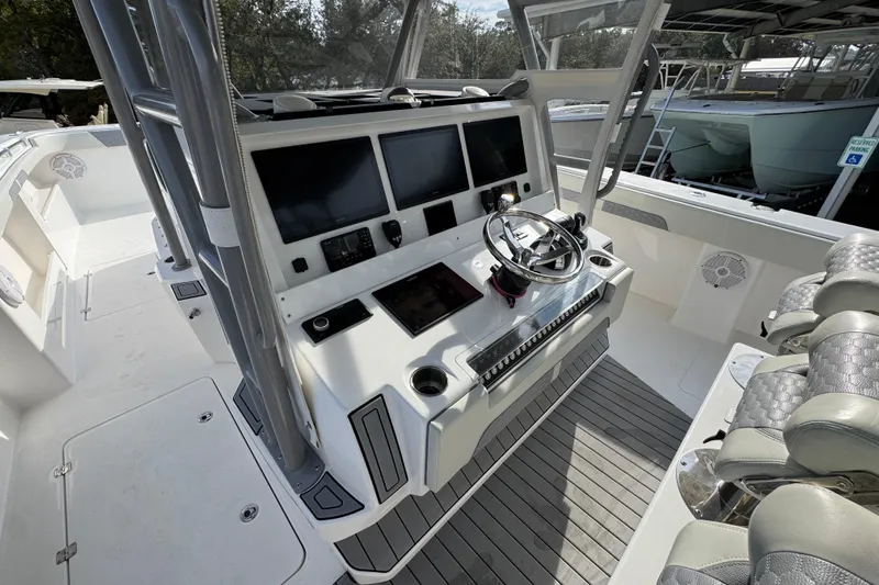  Yacht Photos Pics 2023 Invincible 46 Catamaran helm with advanced navigation displays and luxurious seating.