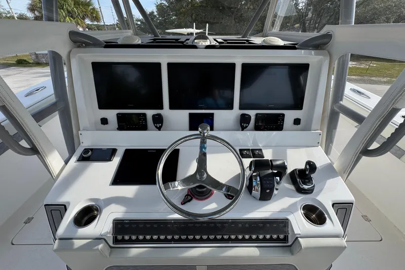  Yacht Photos Pics 2023 Invincible 46 Catamaran helm with advanced navigation displays and controls.