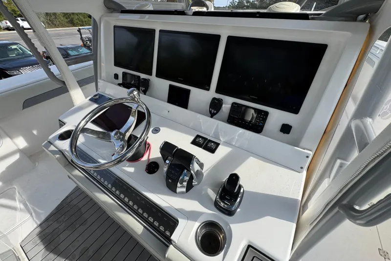  Yacht Photos Pics Helm of 2023 Invincible 46 Catamaran with advanced navigation displays and controls.