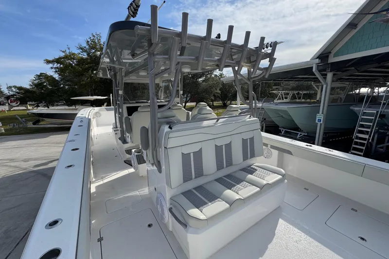  Yacht Photos Pics 2023 Invincible 46 Catamaran with sleek seating and modern design in a marina setting.