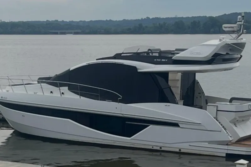 Dream Yacht Photos Pics 2019 Galeon 470 Sky yacht docked on a serene lake.