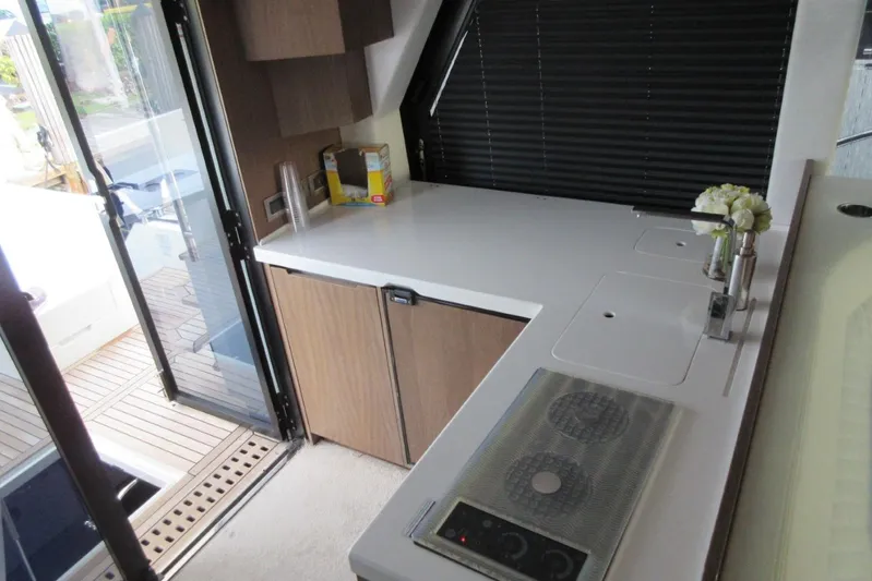 Dream Yacht Photos Pics Interior of 2019 Galeon 470 Sky yacht kitchen with modern appliances and sleek design.