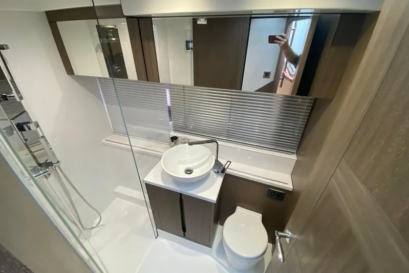 Dream Yacht Photos Pics Modern bathroom in 2019 Galeon 470 Sky yacht with sleek fixtures and wood accents.